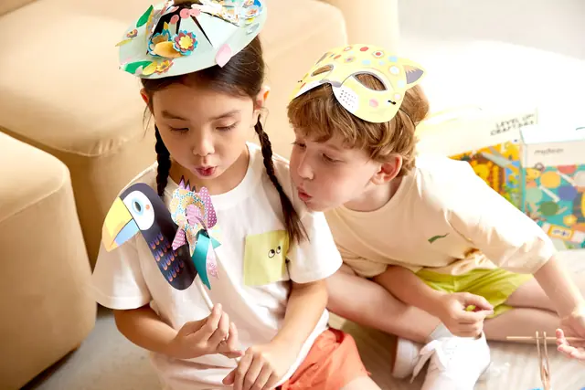 Children playing a mideer game together on the sofa