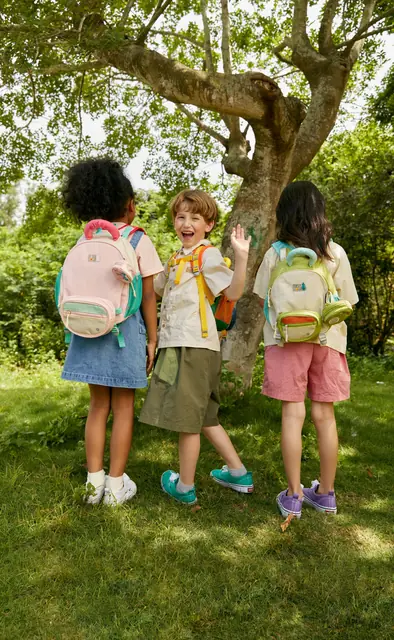 Children wearing mideer backpacks outdoors