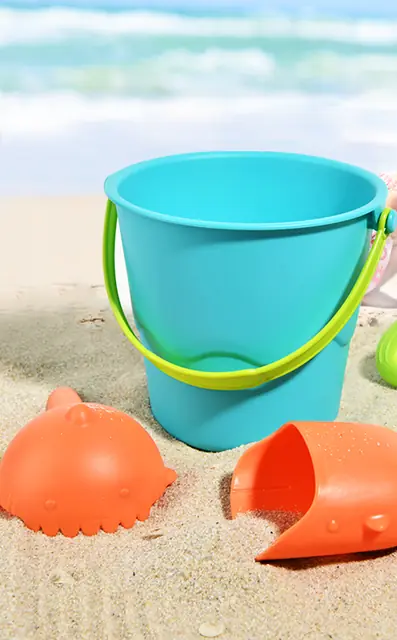 mideer bucket, sieve and spade on the sand
